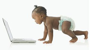 baby looking into computer