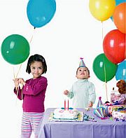 happy kids playing with ballons